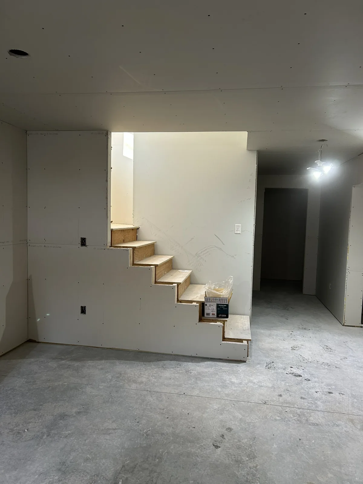 Staircase Hung with Sheetrock in this basement renovation.