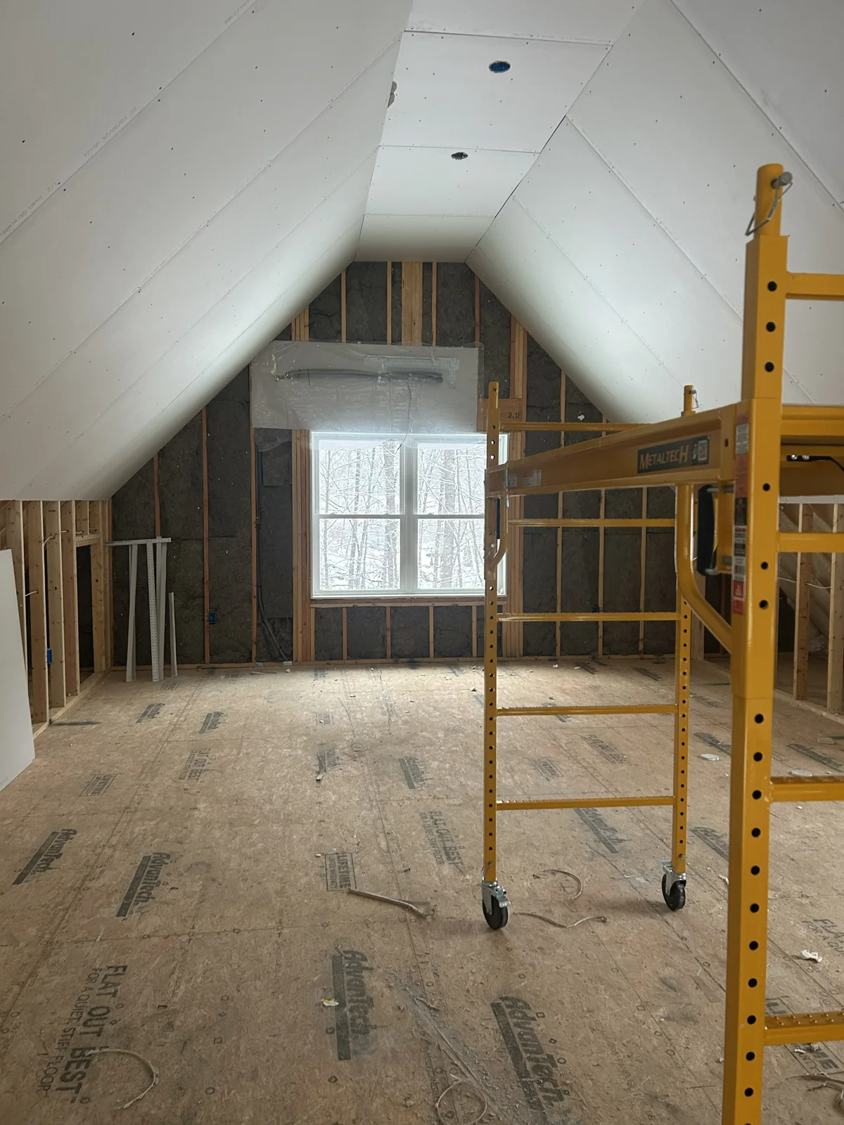 Vaulted ceiling loft hung with sheetrock