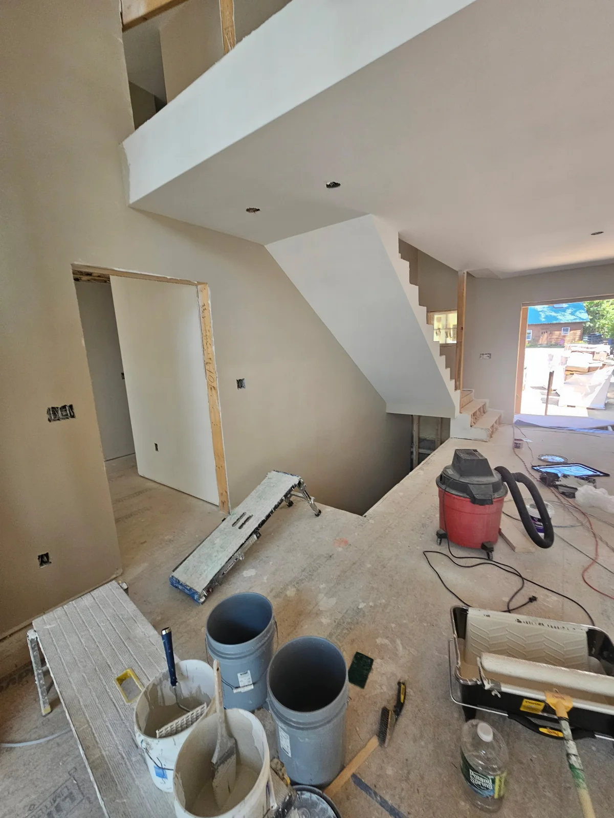 Sheetrock on Wall, ceiling and staircase in custom built home.
