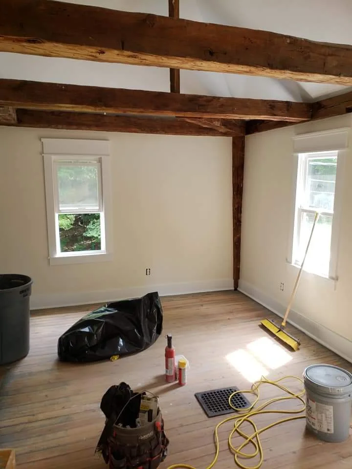 T&B Paint Pros LLC close-up of post-and-beam details with vaulted ceilings and white paint. Showcasing craftsmanship and architectural beauty in home renovation. Flagler County painter, home remodeling, custom painting.